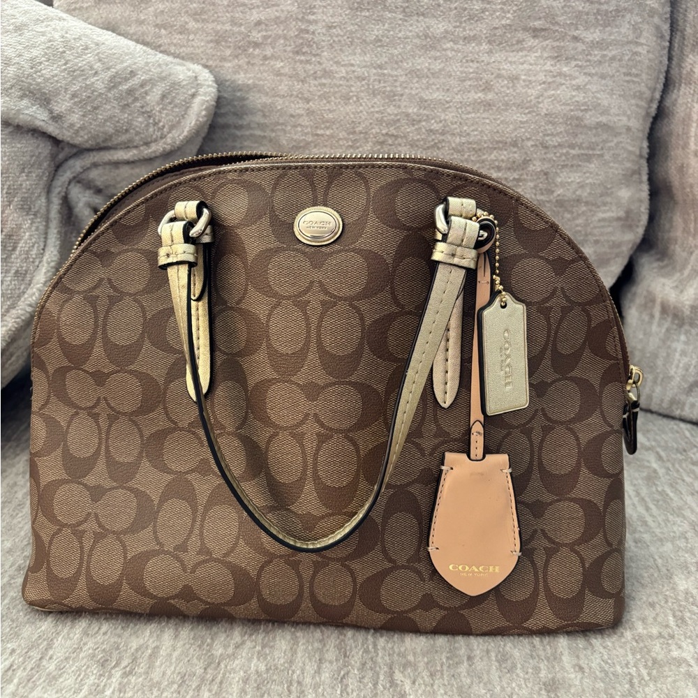 COACH Peyton Signature Monogram Coated
Canvas w/ crossbody strap